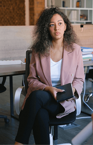 Woman sitting and looking thoughtfully
